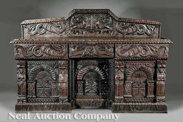 Appraisal: A Carved Oak Buffet th c the pedimented backsplash with