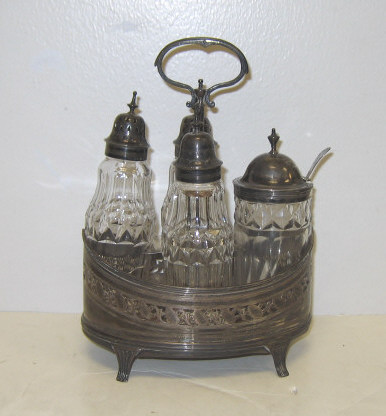 Appraisal: THOMAS OLLIVANT LONDON George III silver four-bottle cruet stand boat