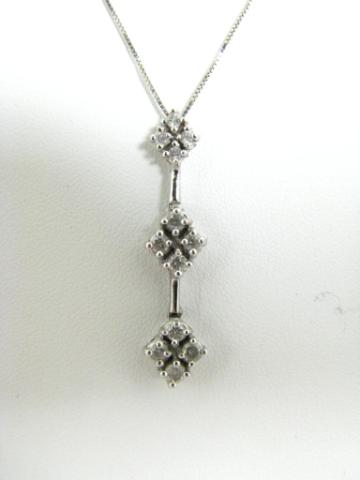 Appraisal: K white gold diamond pendant with twelve round diamonds on