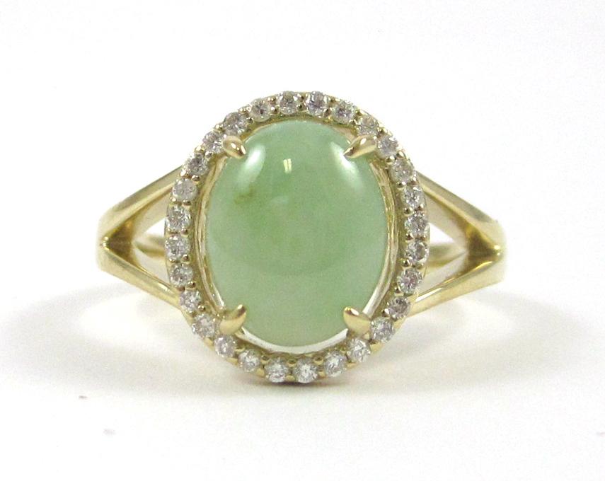 Appraisal: JADE DIAMOND AND FOURTEEN KARAT GOLD RING with round-cut diamonds