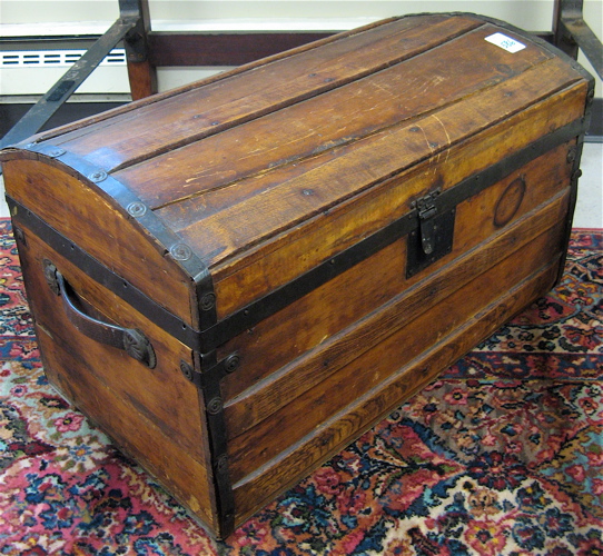 Appraisal: ANTIQUE TRUNK AND QUILTED BEDSPREAD American c The old wood