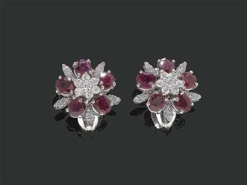 Appraisal: RUBY AND BRILLIANT-CUT DIAMOND CLIP EARRINGS White gold Elegant flower-shaped