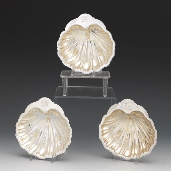 Appraisal: THREE BARKER BROTHERS SILVER PLATED ARMORIAL SHELL DISHES BIRMINGHAM CA