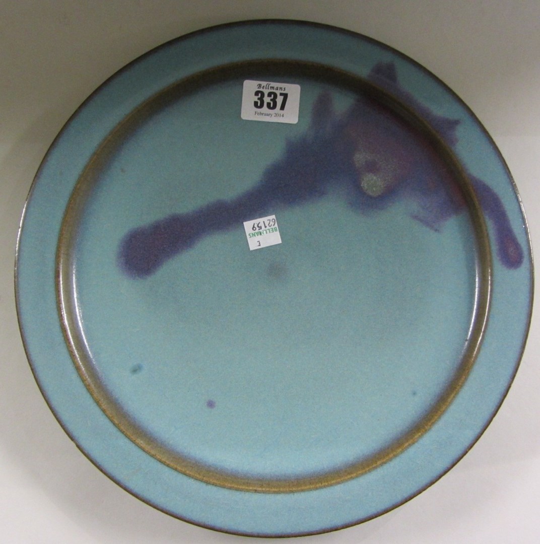 Appraisal: A Chinese Jun' type shallow dish splashed with purple against