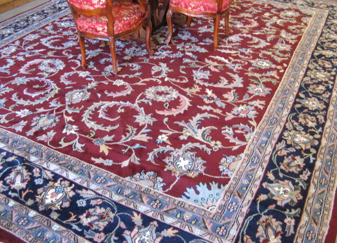 Appraisal: LARGE ORIENTAL CARPET Indo-Kashan overall floral design on red ground