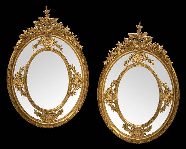 Appraisal: A pair of Louis XVI style carved giltwood mirrors The