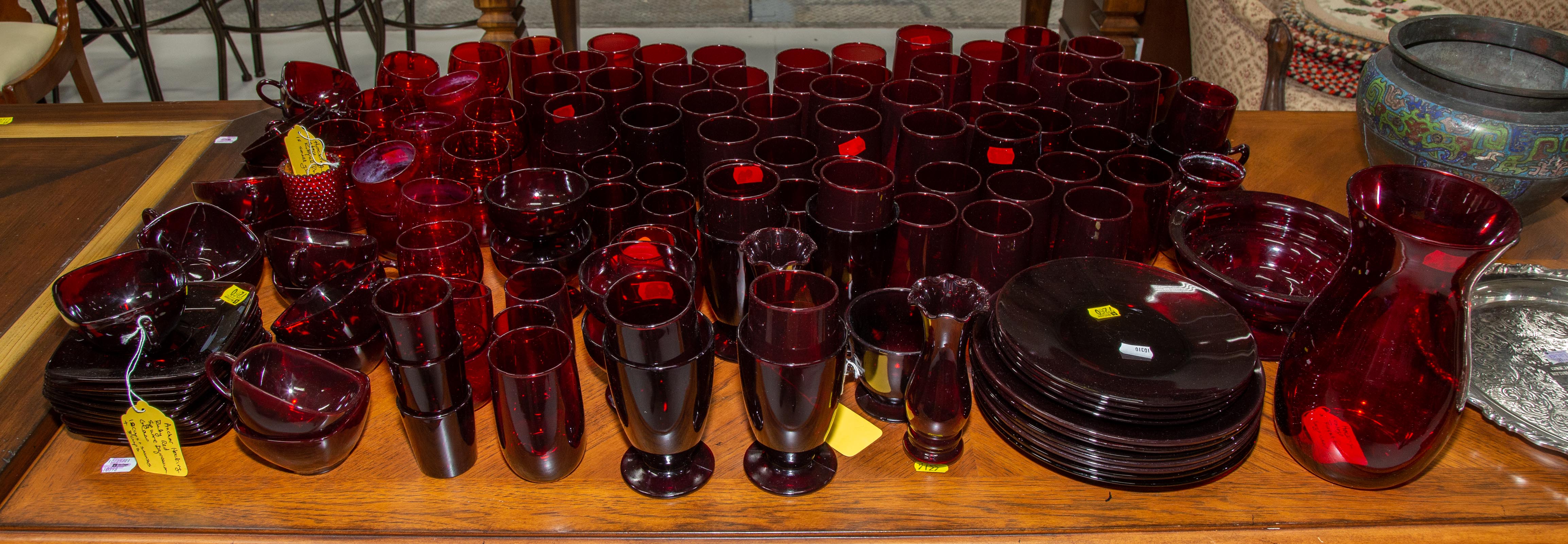 Appraisal: A LARGE COLLECTION OF RED GLASSWARE Includes saucers two vases