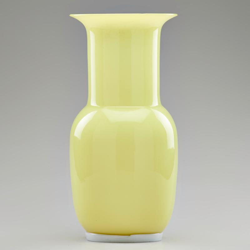 Appraisal: TOMASO BUZZI VENINI Incamiciato yellow cased glass vase with applied