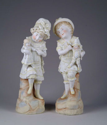 Appraisal: LOT OF TWO BISQUE FIGURINES Young girls with dolls standing