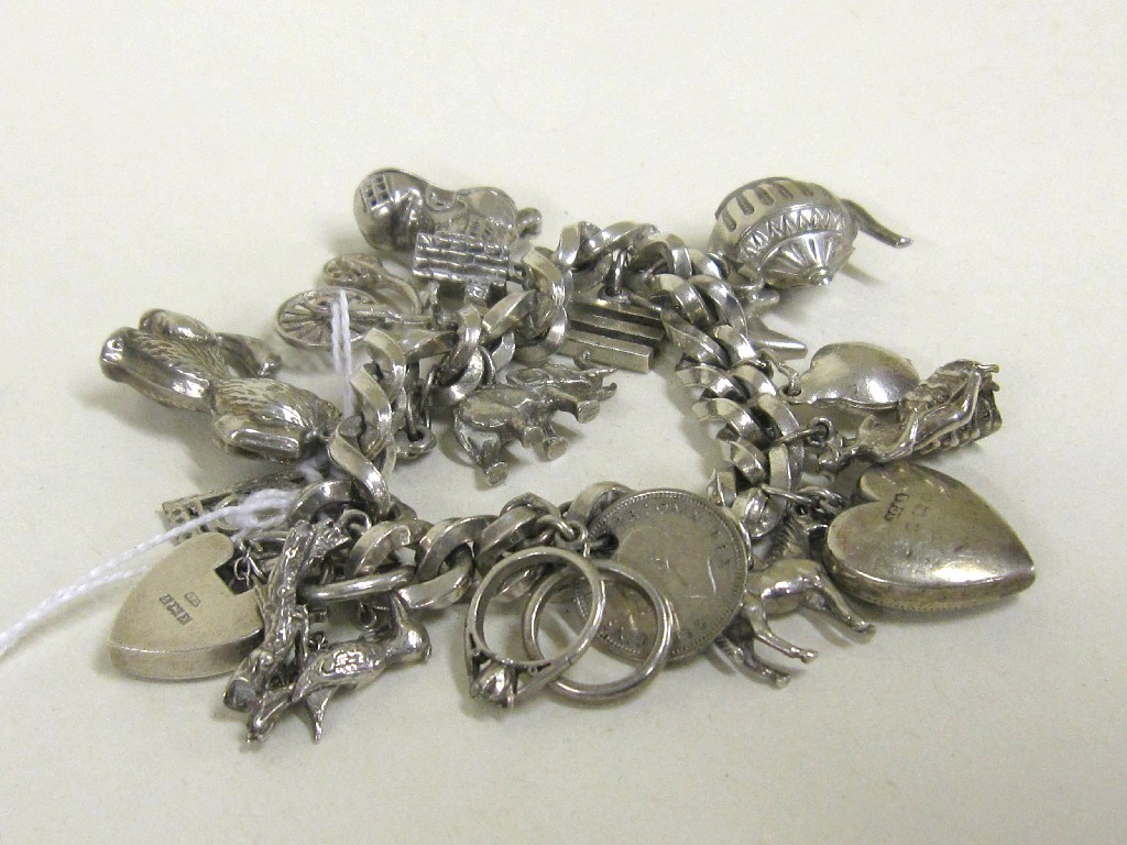 Appraisal: Silver charm bracelet with fifteen various charms