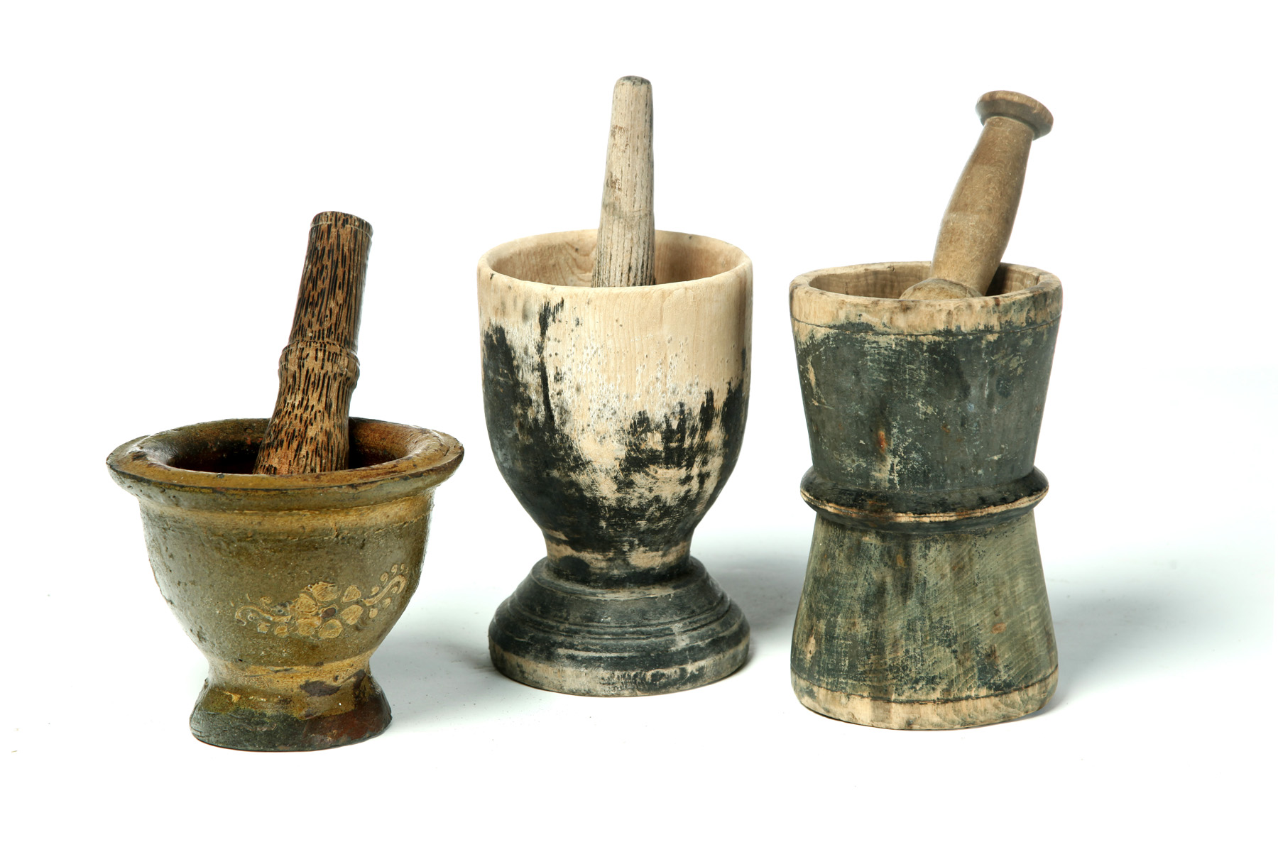 Appraisal: THREE MORTARS AND PESTLES American and possibly European th century