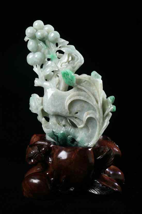 Appraisal: CHINESE CELADON AND APPLE GREEN JADEITE CARVING OF FRUIT BRANCH