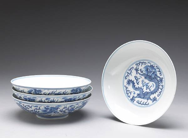 Appraisal: Four blue and white porcelain dragon bowls Guangxu Marks and