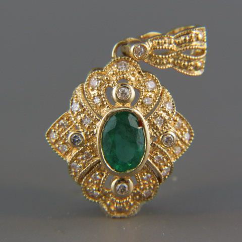 Appraisal: Emerald Diamond Pendant carat oval gem vivid green surrounded by