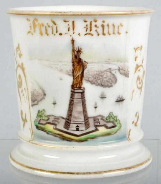 Appraisal: Statue of Liberty Aerial View Shaving Mug Description Gilt name