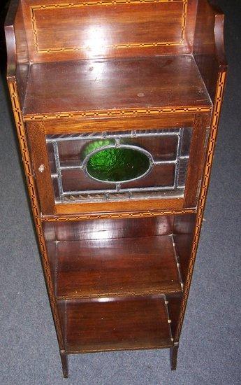 Appraisal: An Edwardian bookcase with chequer inlay with shelf above a