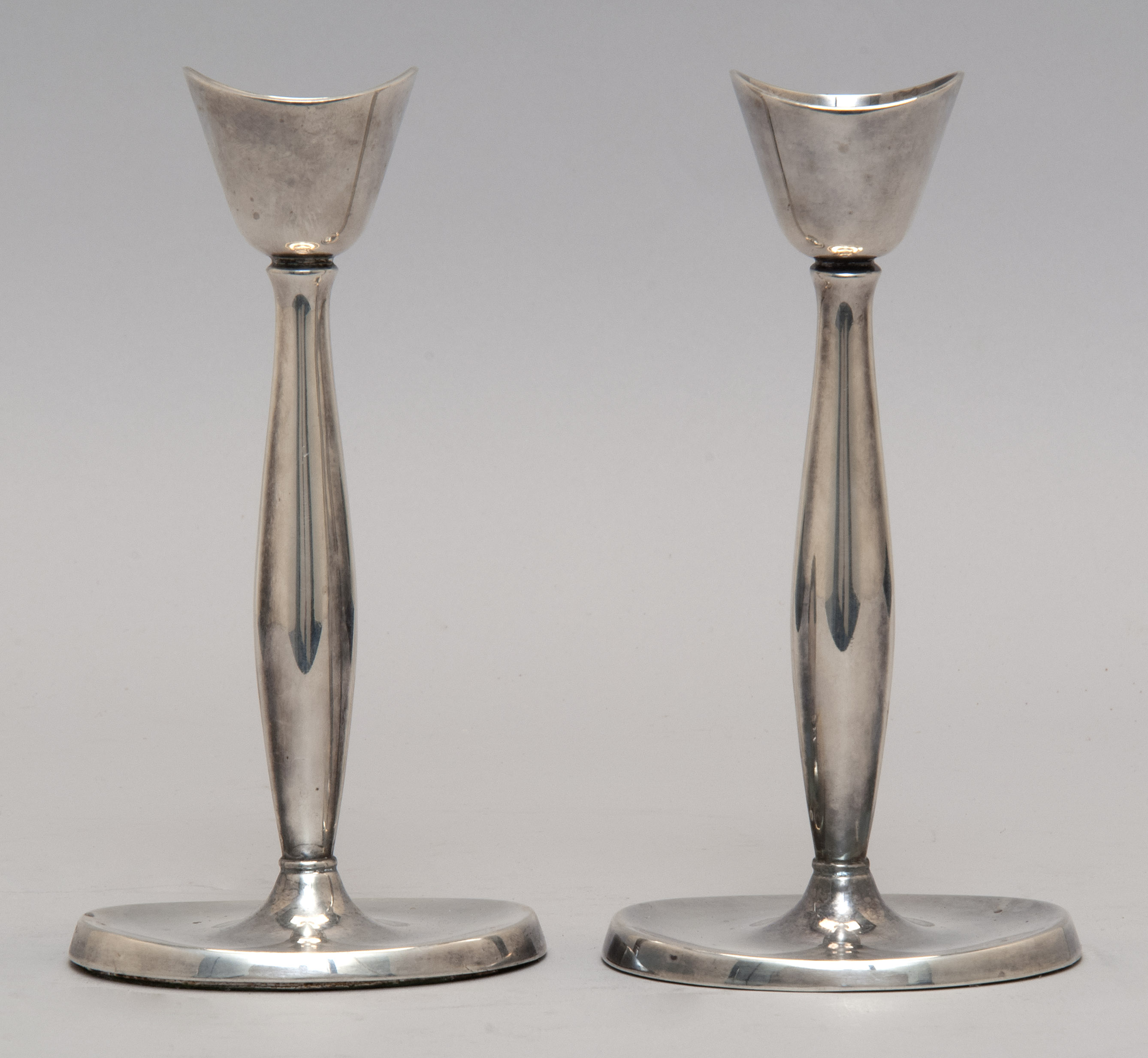 Appraisal: PAIR OF DANISH ELECTROPLATED SILVER CANDLESTICKS BY COHR OF DENMARK