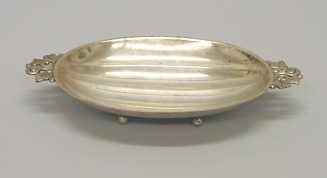 Appraisal: Twin-handled oval ribbed bowl L made in l approximately troy