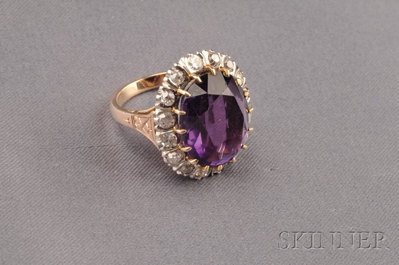 Appraisal: Amethyst and Diamond Ring prong-set with an oval-cut amethyst measuring