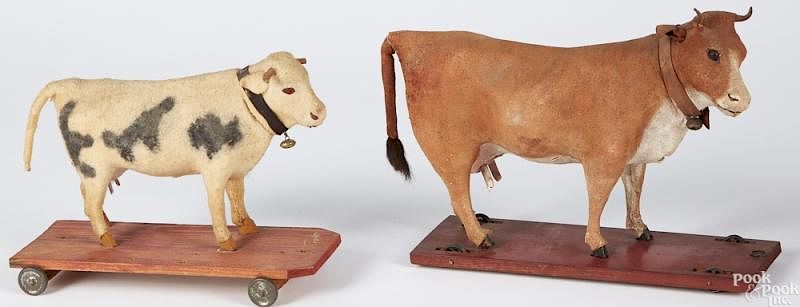 Appraisal: Two cow on platform pull toys Two cow on platform