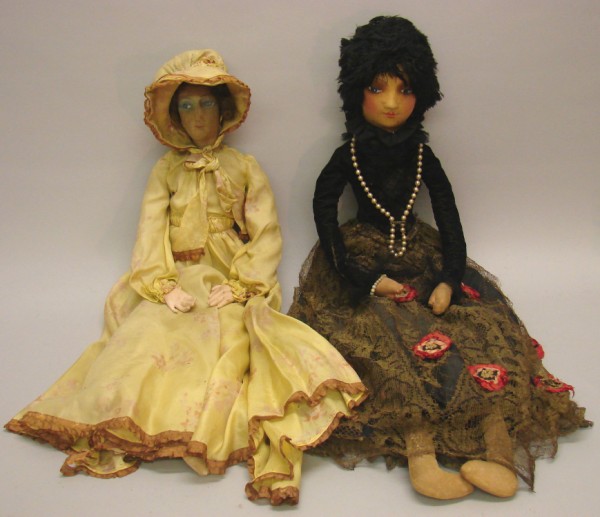 Appraisal: Pair of boudoir dolls Has a mask face curly brown