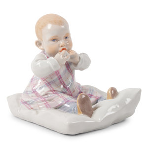 Appraisal: A Meissen Porcelain Figure of a Baby Feeding by Konrad