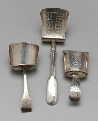 Appraisal: Three English silver caddy spoons all shovel type Birmingham floral-engraved