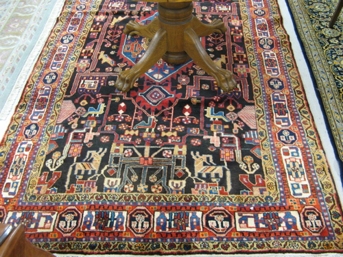 Appraisal: PERSIAN TRIBAL CARPET Hamadan villages region central medallion and overall