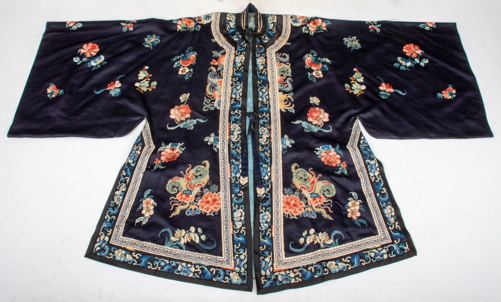 Appraisal: CHINESE EMBROIDERED NAVY BLUE SILK ROBE Chinese navy blue silk