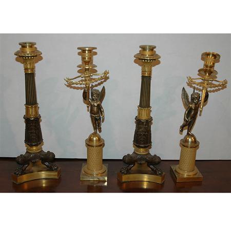 Appraisal: Two Pairs of Restauration Gilt-Bronze Candlesticks Estimate -