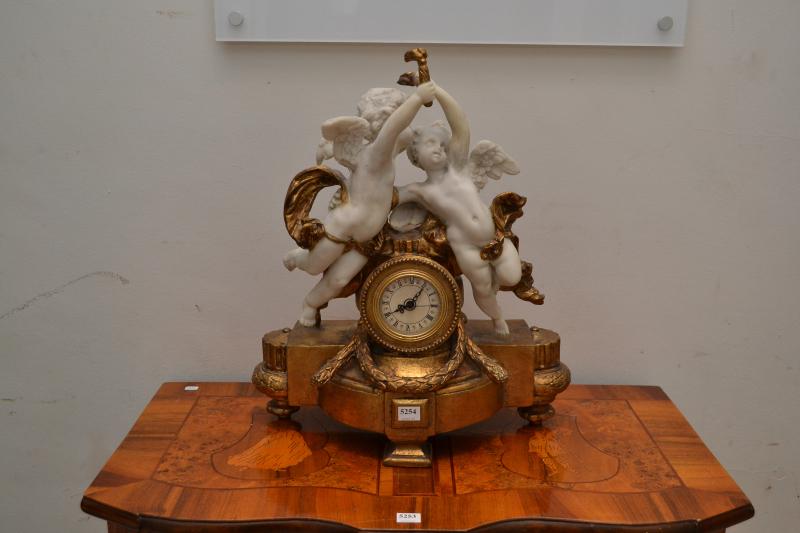 Appraisal: A GILT CHERUB STYLE MANTEL CLOCK A GILT CHERUB STYLEMANTEL