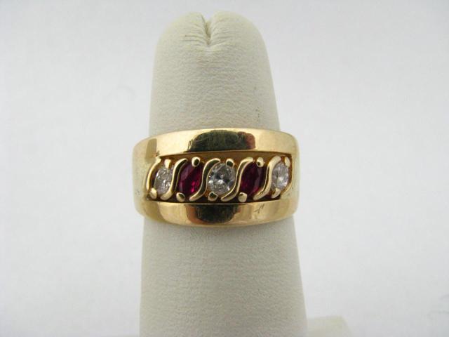 Appraisal: Lady's K yellow gold diamond and ruby band ring with