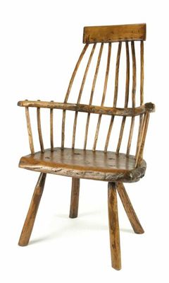 Appraisal: A primitive ash and sycamore Windsor chair the comb back