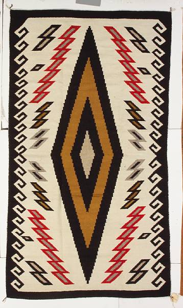 Appraisal: A Navajo rug Eleanor Nelson centering a prominent diamond medallion