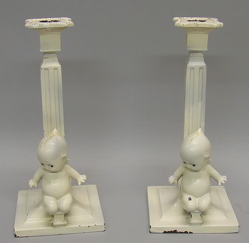 Appraisal: Pair of metal candlesticks Ivory columns with s kneeling at