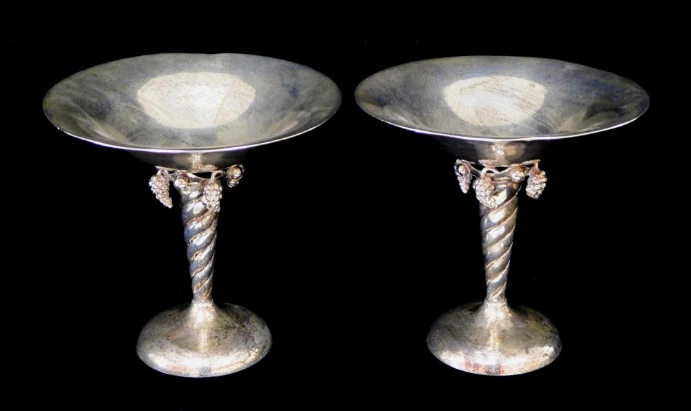 Appraisal: STERLING Pair William De Matteo silver tazas with grape clusters