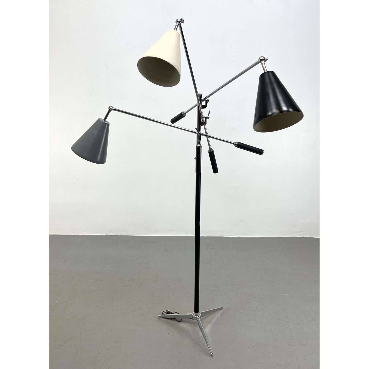 Appraisal: ANGELO LELII Triennale floor lamp Three enameled cone shades Stamped