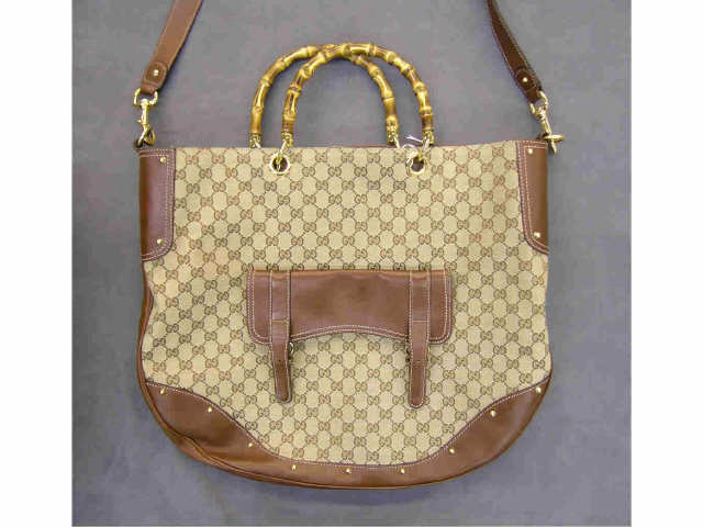 Appraisal: Gucci handbag large tote with bamboo handle removable shoulder strap