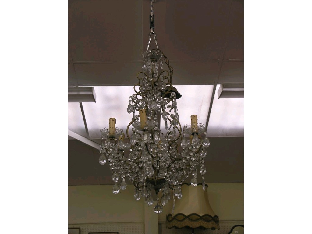 Appraisal: A pair of glass and gilt-metal chandeliers each with six