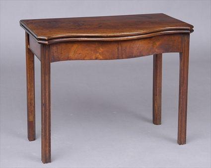 Appraisal: GEORGE III CARVED MAHOGANY SERPENTINE-FRONTED GAMES TABLE The folding top