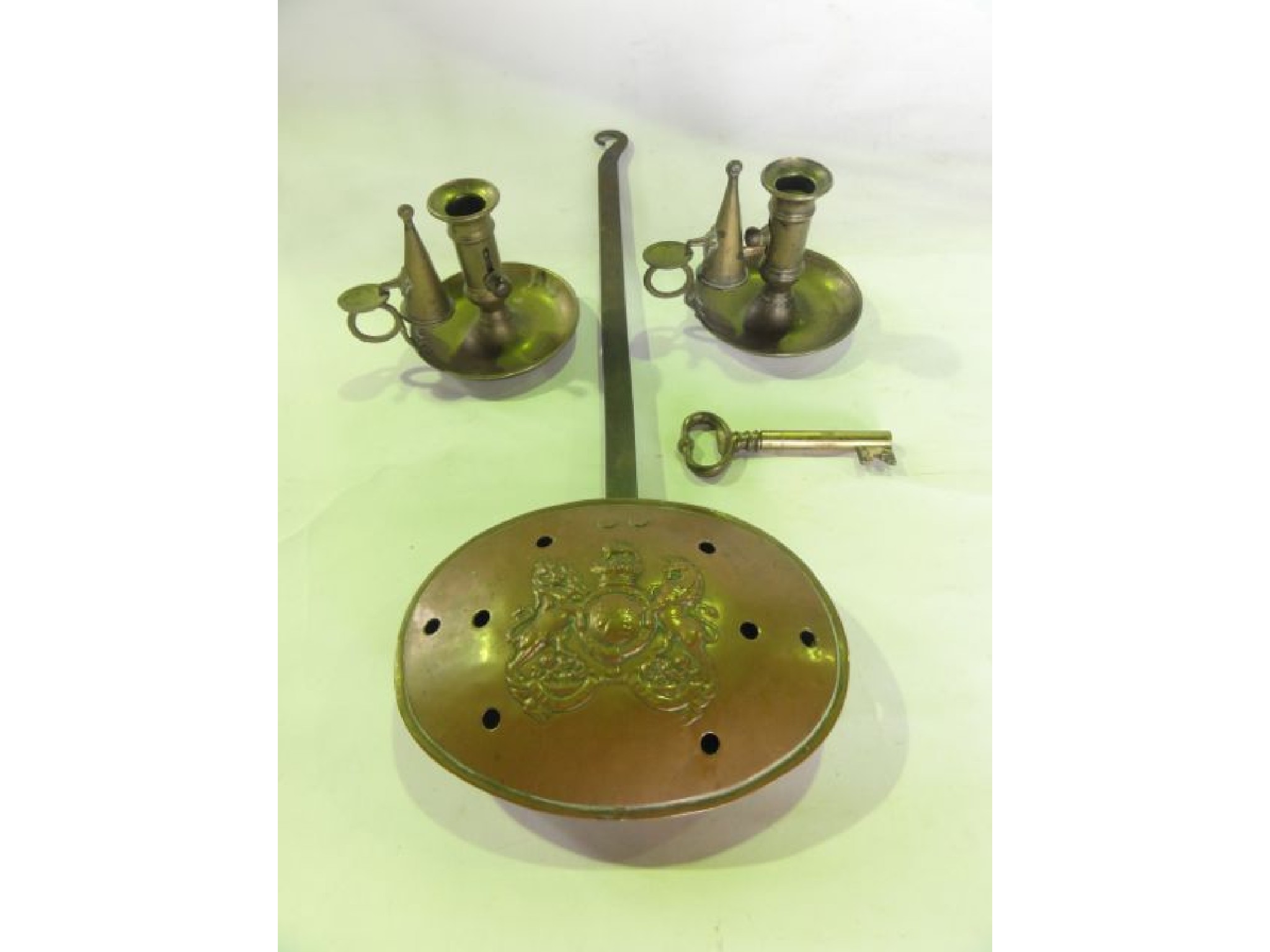 Appraisal: A th century pierced copper chestnut roaster with embossed coat