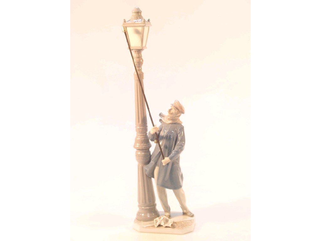 Appraisal: A Lladro figure of a lamp lighter wearing a blue