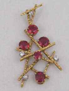 Appraisal: An carat gold openwork natural spinel and diamond pendant approx