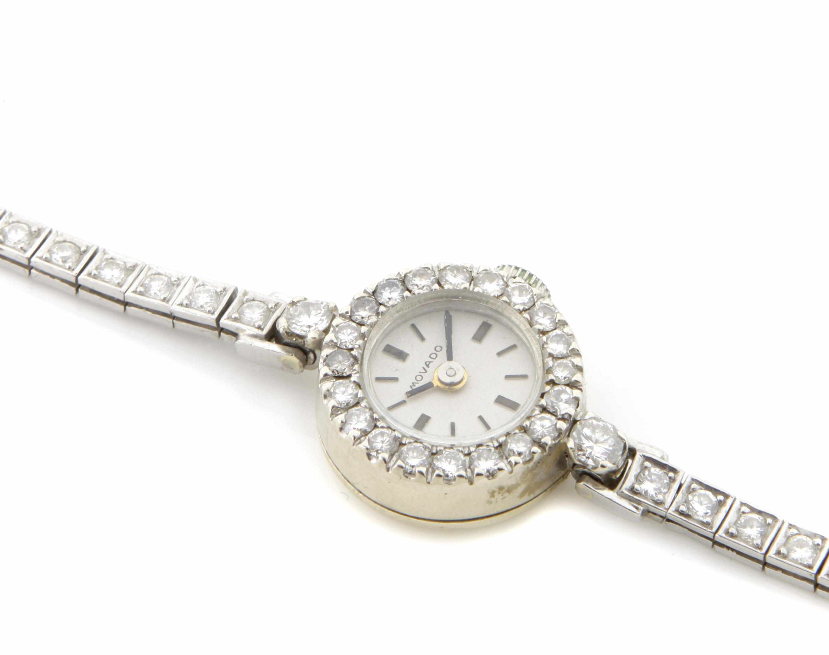 Appraisal: A diamond and white gold wristwatch together with a diamond