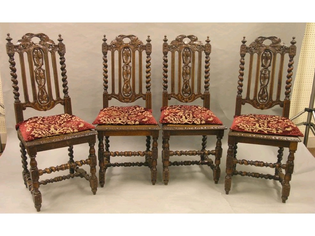 Appraisal: A set of four late Victorian carved oak dining chairs