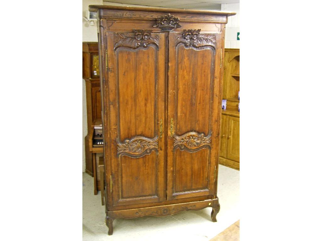 Appraisal: th century French provincial pine armoire the moulded top over