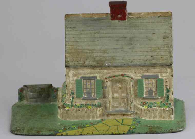 Appraisal: COTTAGE WITH WELL DOORSTOP ''Copyright A A Richard Quincy Mass