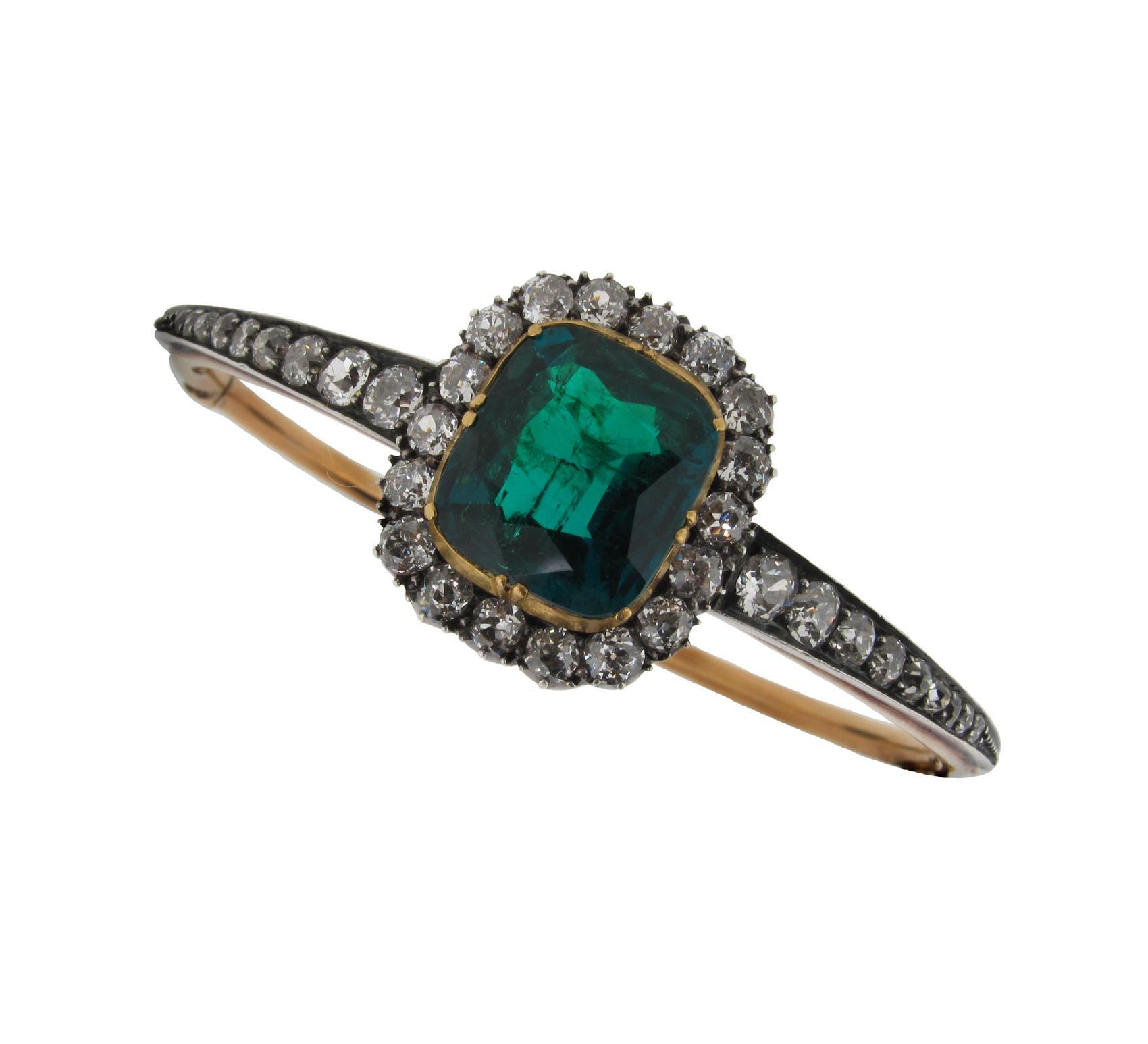 Appraisal: A late th Century emerald and diamond hinged bangle