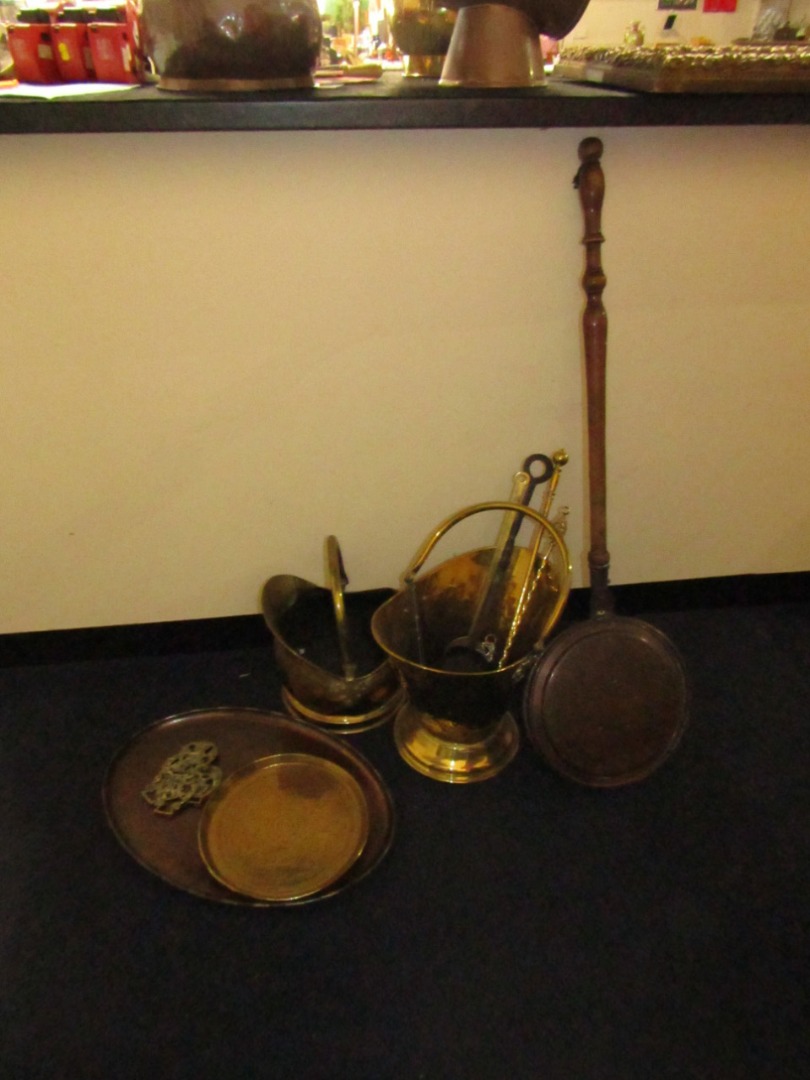 Appraisal: Two brass coal buckets three fire irons horse brasses chestnut