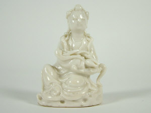 Appraisal: Small Chinese blanc de chine seated female figure wearing a